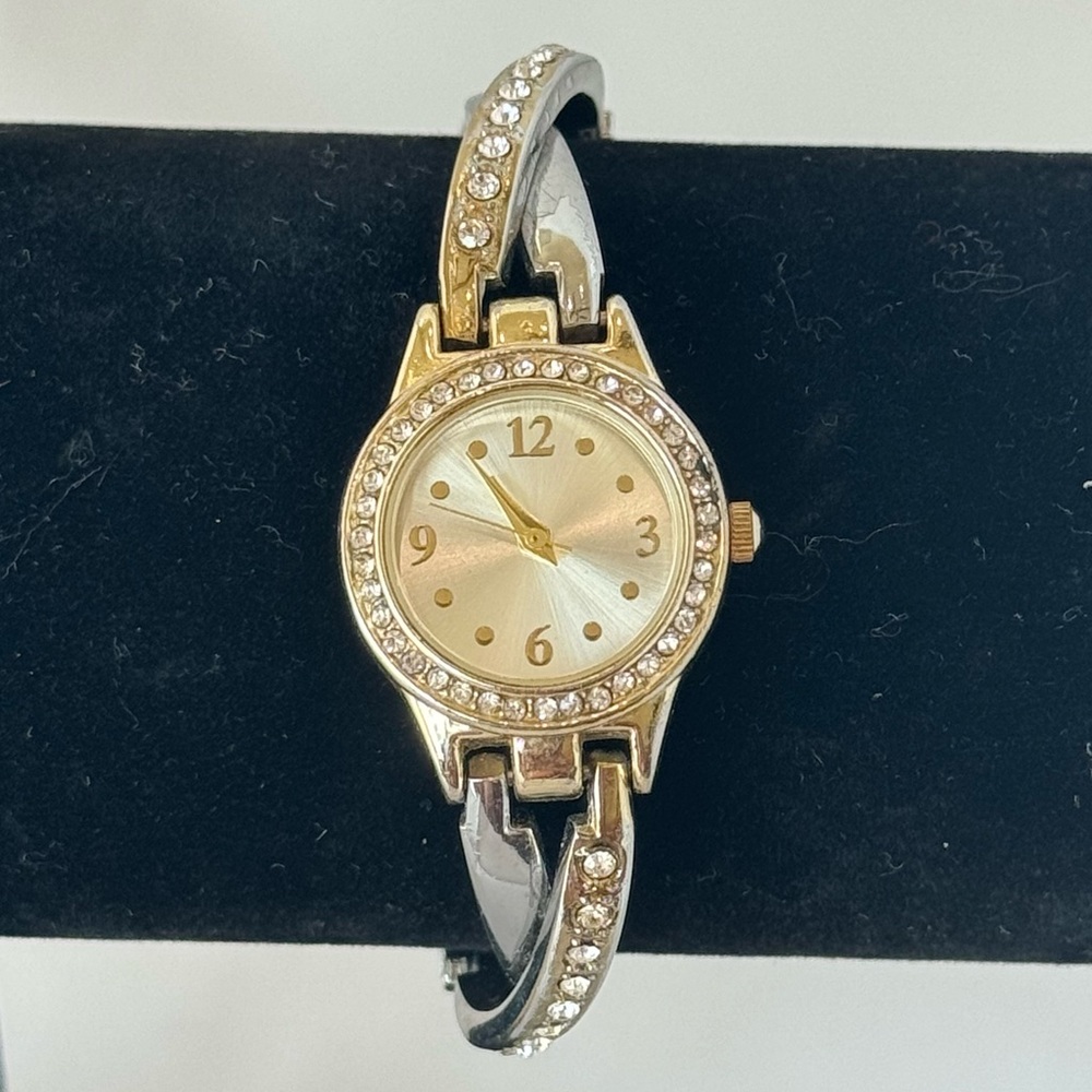 Women’s gold and silver two toned clasp band style watch